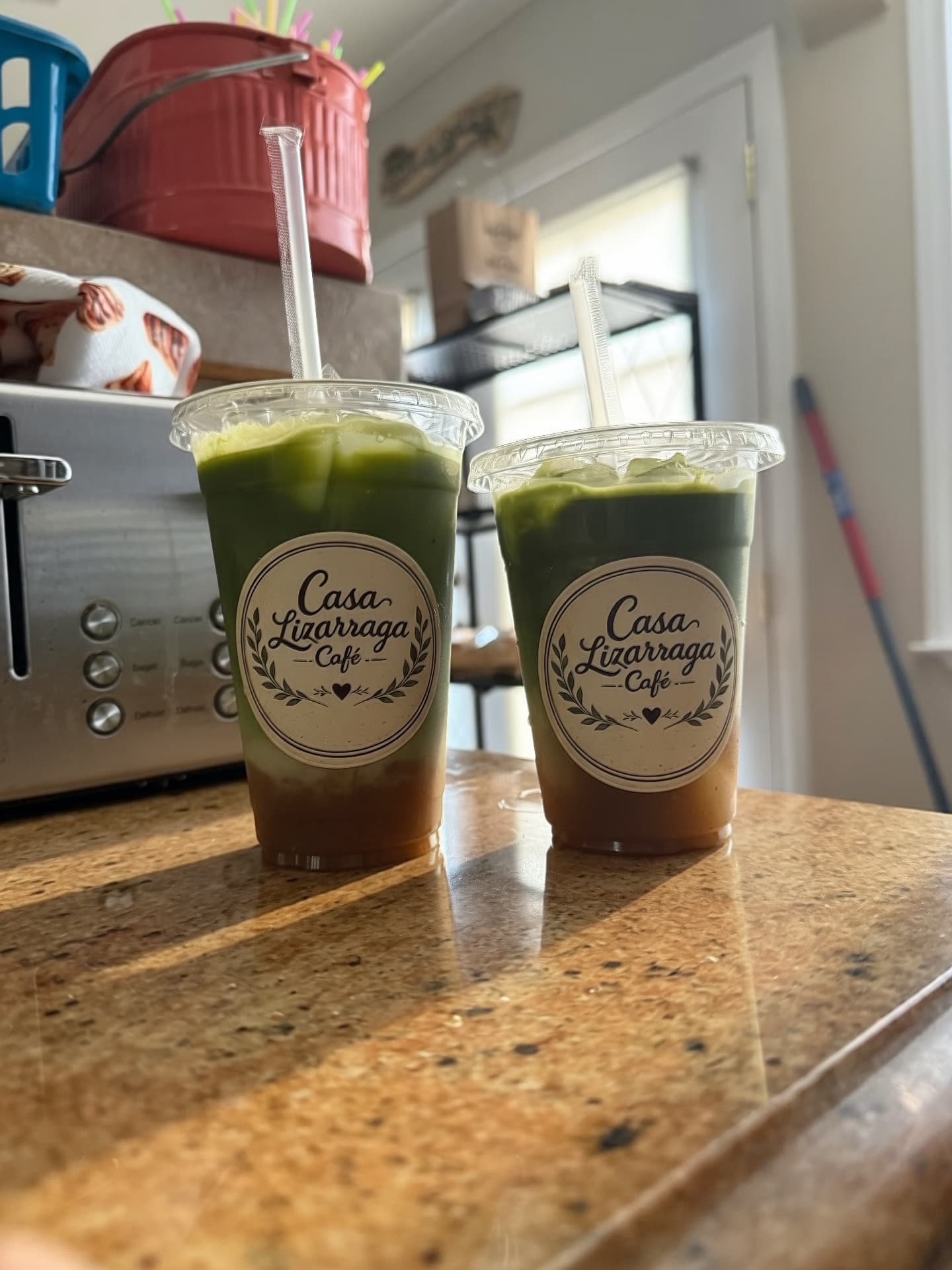 Two iced matcha lattes side by side